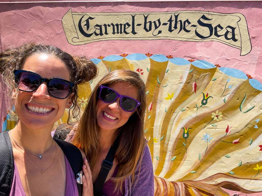 Women taking a selfie at Carmen-by-the-Sea mural.