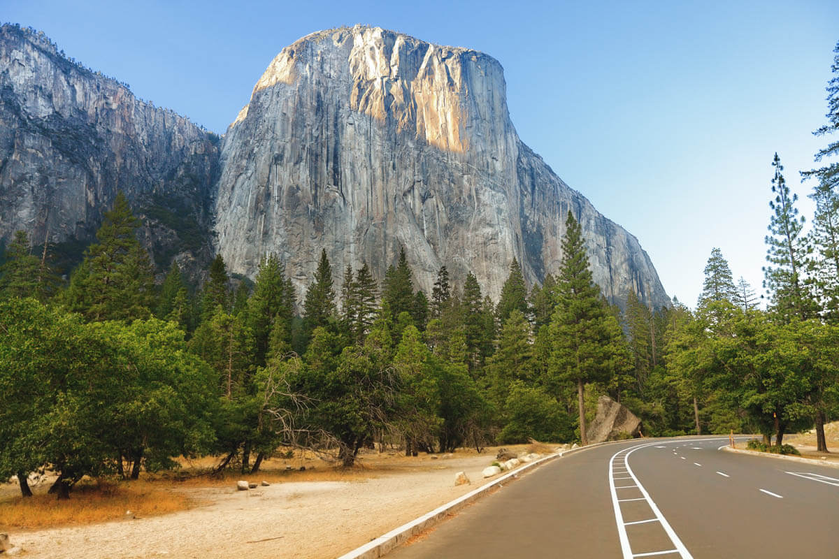 View of El Capitan mountain from the road through Yosemite on a clear day.