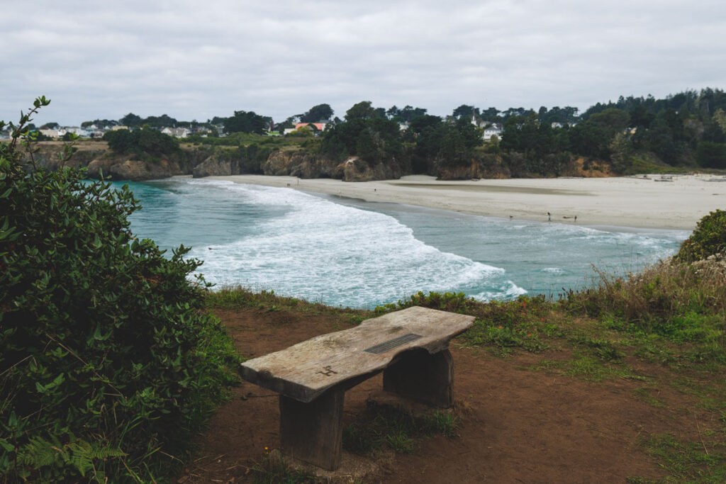 Picnic bench overlooking Mendocino Bay from a viewpoint.