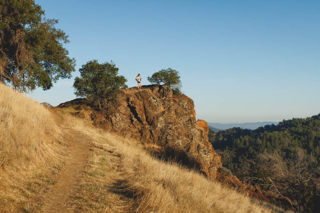 Hiker on the Sugarloaf Ridge State Park Vista trail, one of the things to do in Santa Rosa.