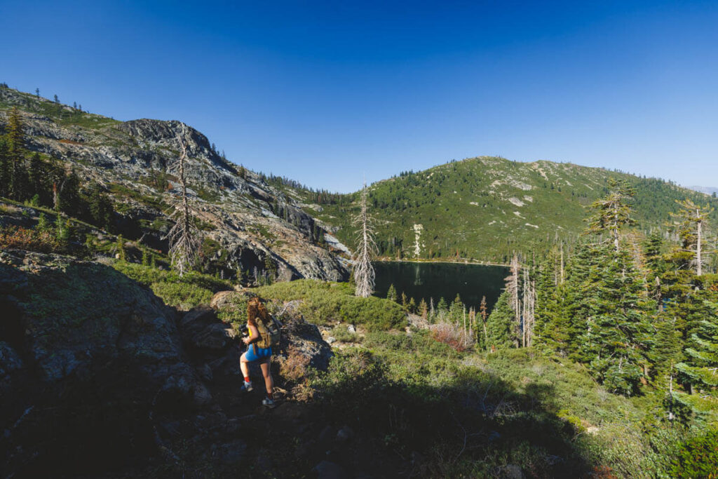 Woman hiking along the Castle Lake to Heart Lake trail.