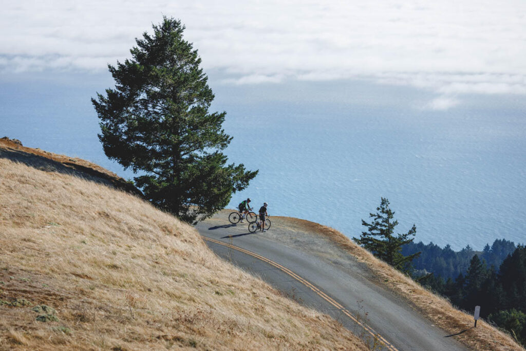 Two cyclists on the edge of a viewpoint in Mount Tamalpais State Park.
