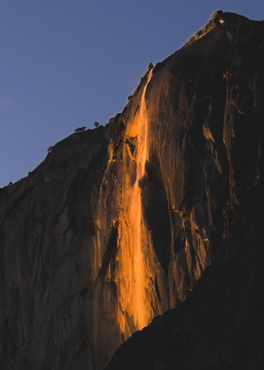 Horsetail Fall in Yosemite National Park looking like a waterfall of lava in the setting sun.