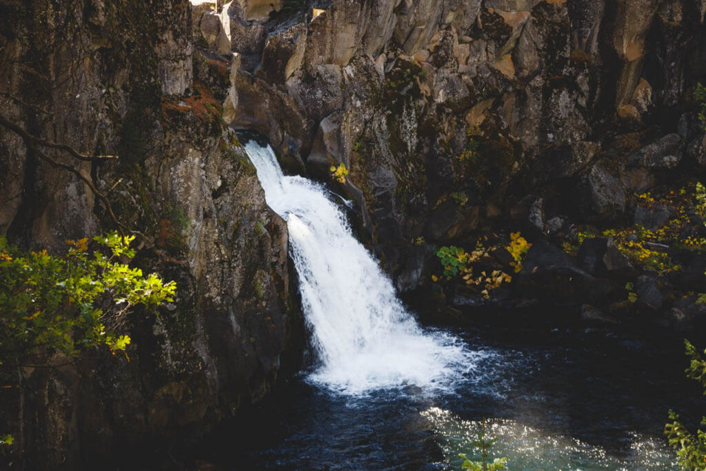 Upper McCloud Falls emerging from the cliff face and pouring into it's plunge pool.