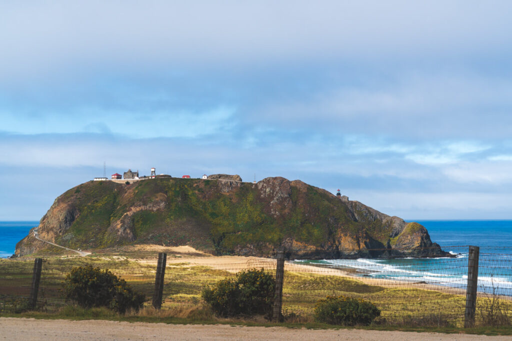 A view over El Sur Ranch on a headland in Andrew Molera State Park.