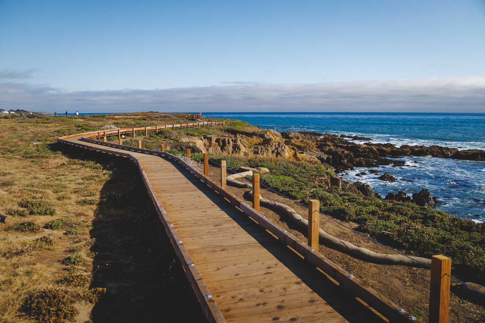 Moonstone Boardwalk trailing off across the coastline of Big Sur near Cambria.