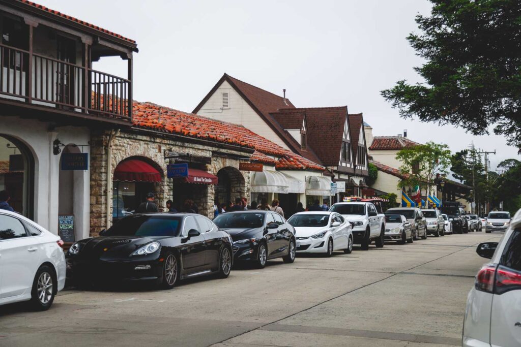 A line of cars parked along Ocean Avenue in Carmel-by-the-Sea.