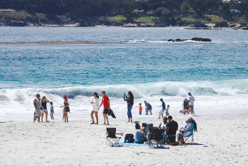 People enjoying their time on Carmel Beach.