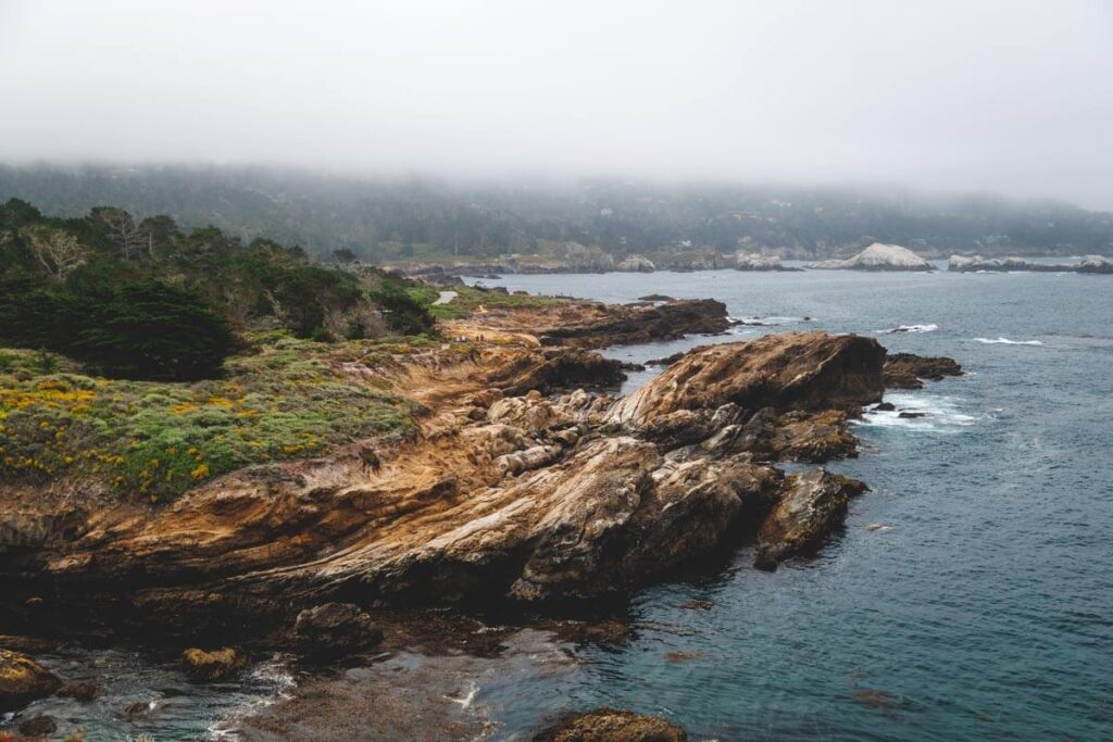 The rugged rocks worn by sea erosion along the coastline of Point Lobos State Natural Reserve.