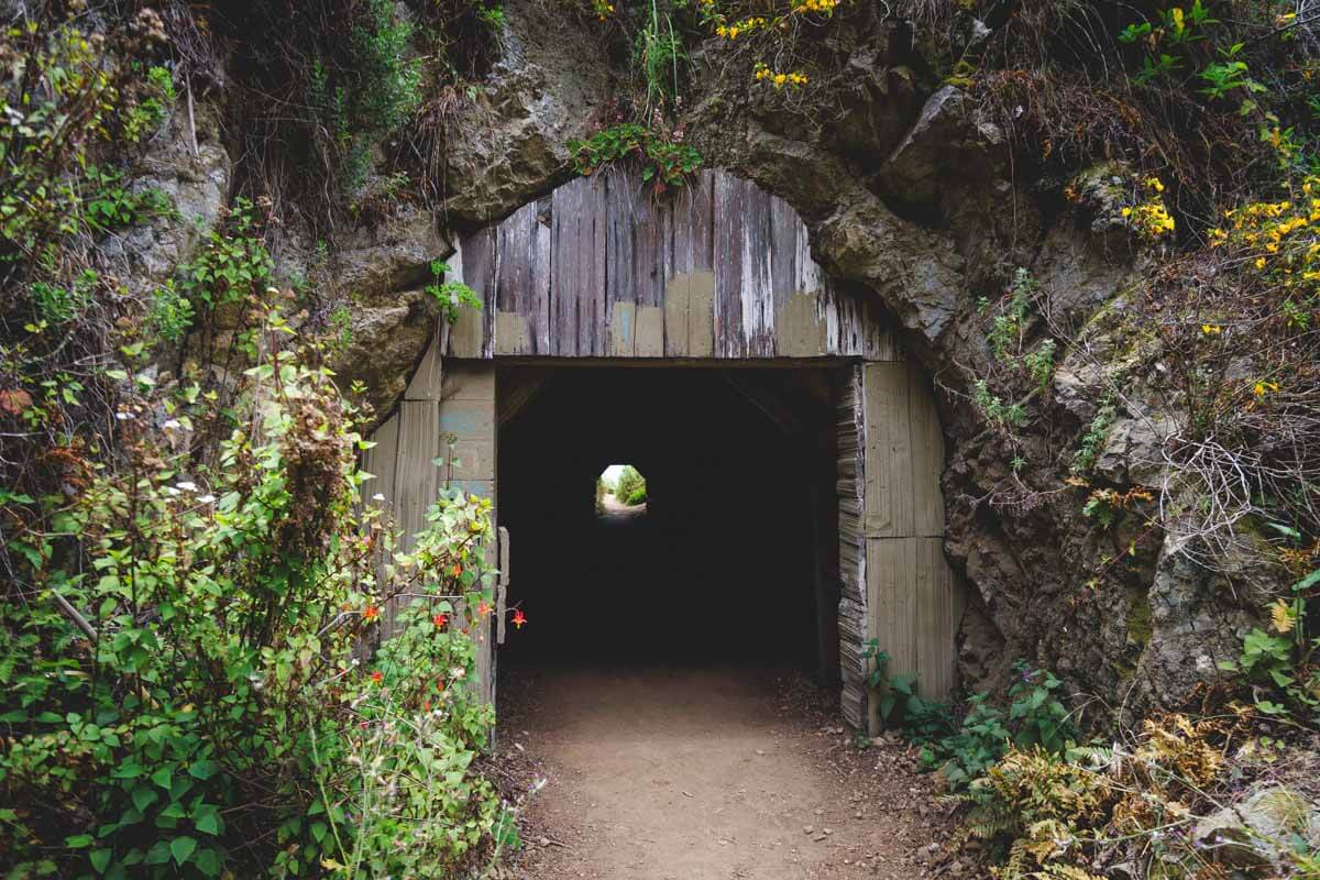 A eerie looking tunnel passing through the cliffs of Partington Cove.