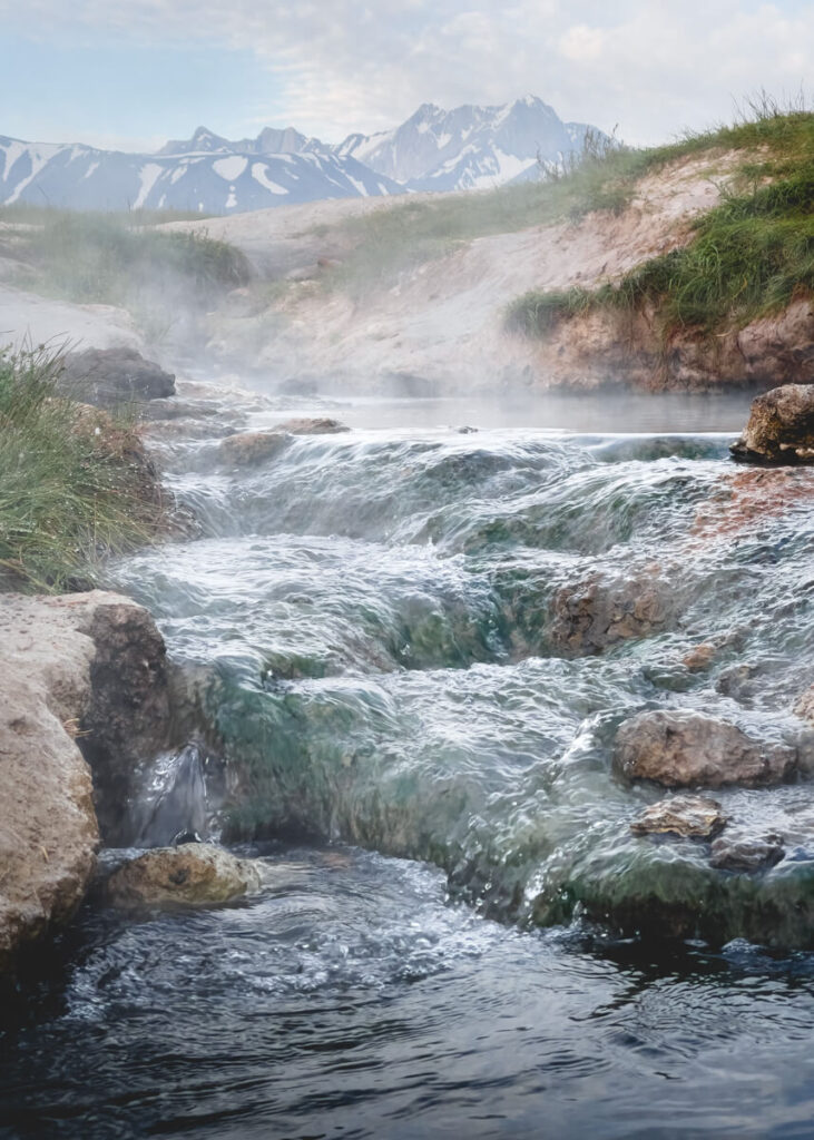 A stream of water flowing between two different pools at Wild Willy's Hot Springs.