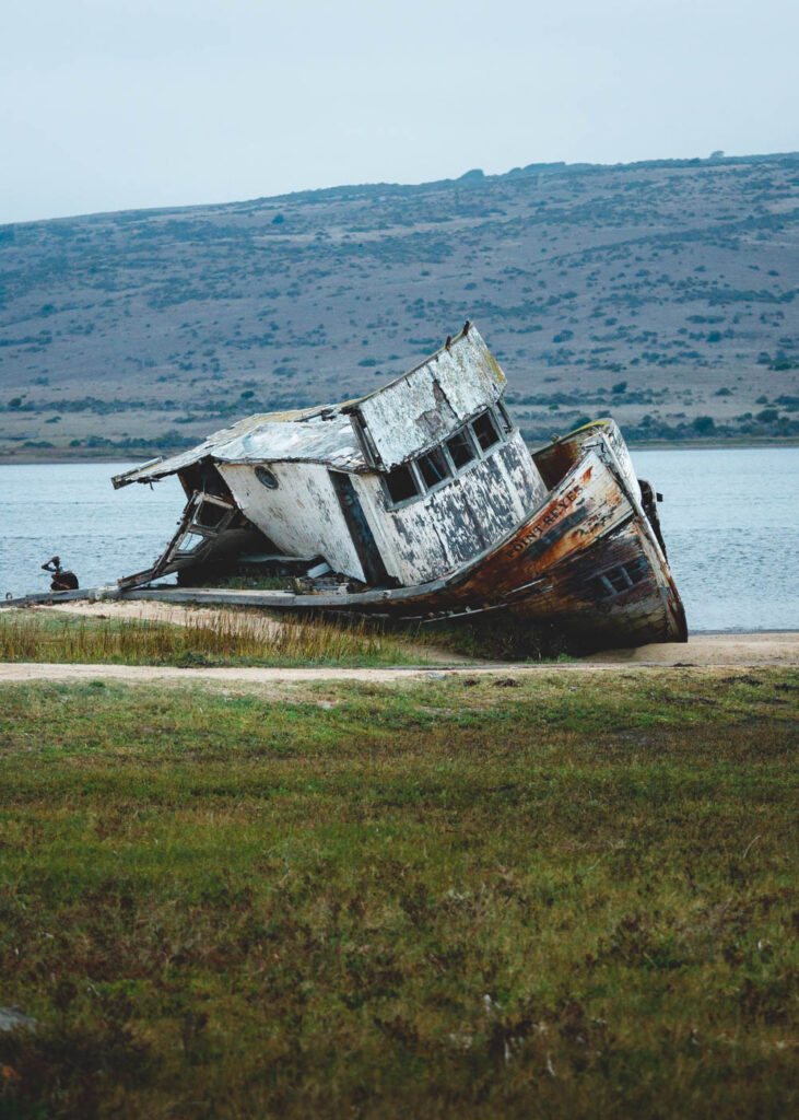 Beached shipwreck near Point Reyes at blue hour.