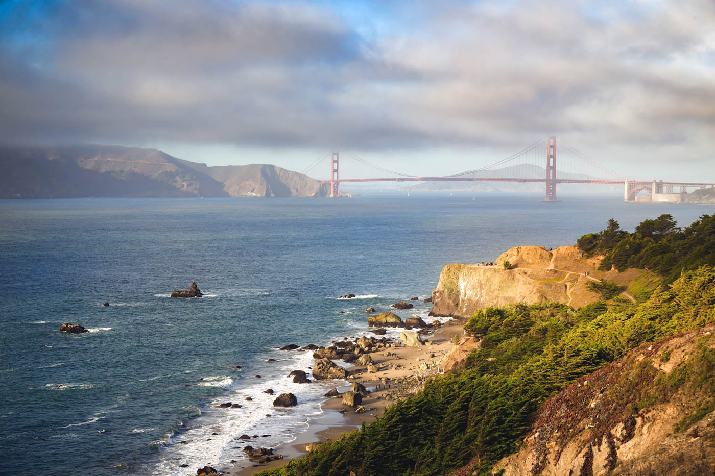 Low cloud view of Golden Gate Bridge from Mile Rock Beach.
