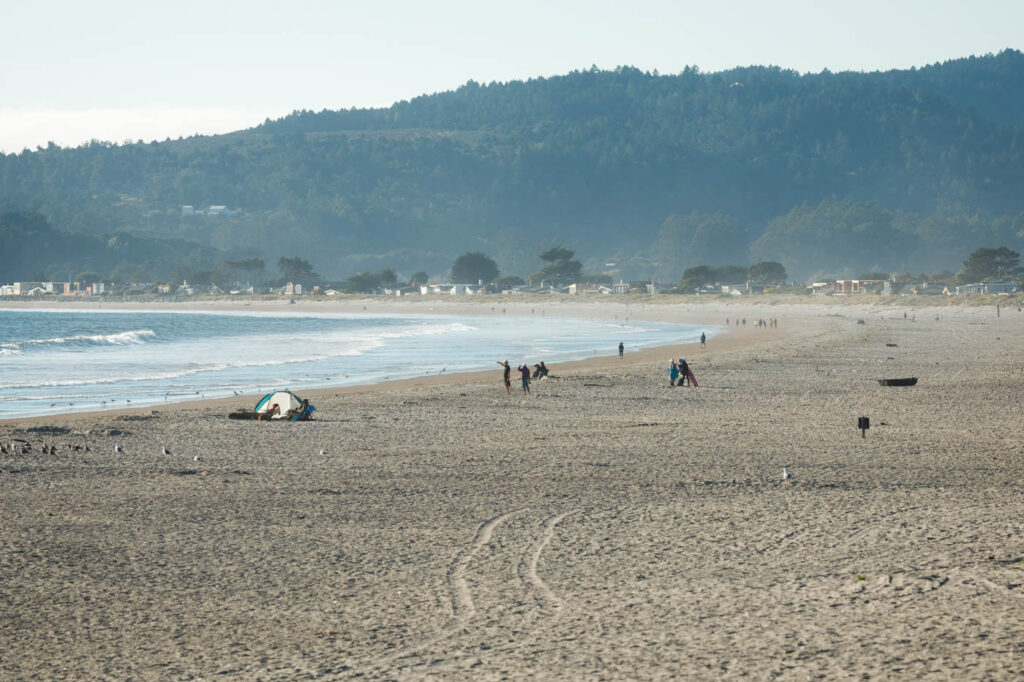 Tourists enjoying the day on Stinson State Beach in California.