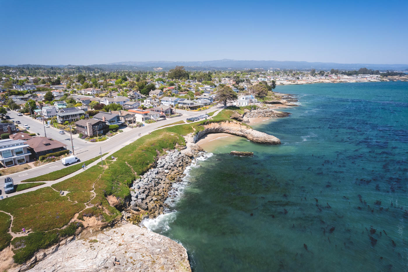 Aerial view over a coastal suburban Santa Cruz along the West Cliff Scenic Drive.