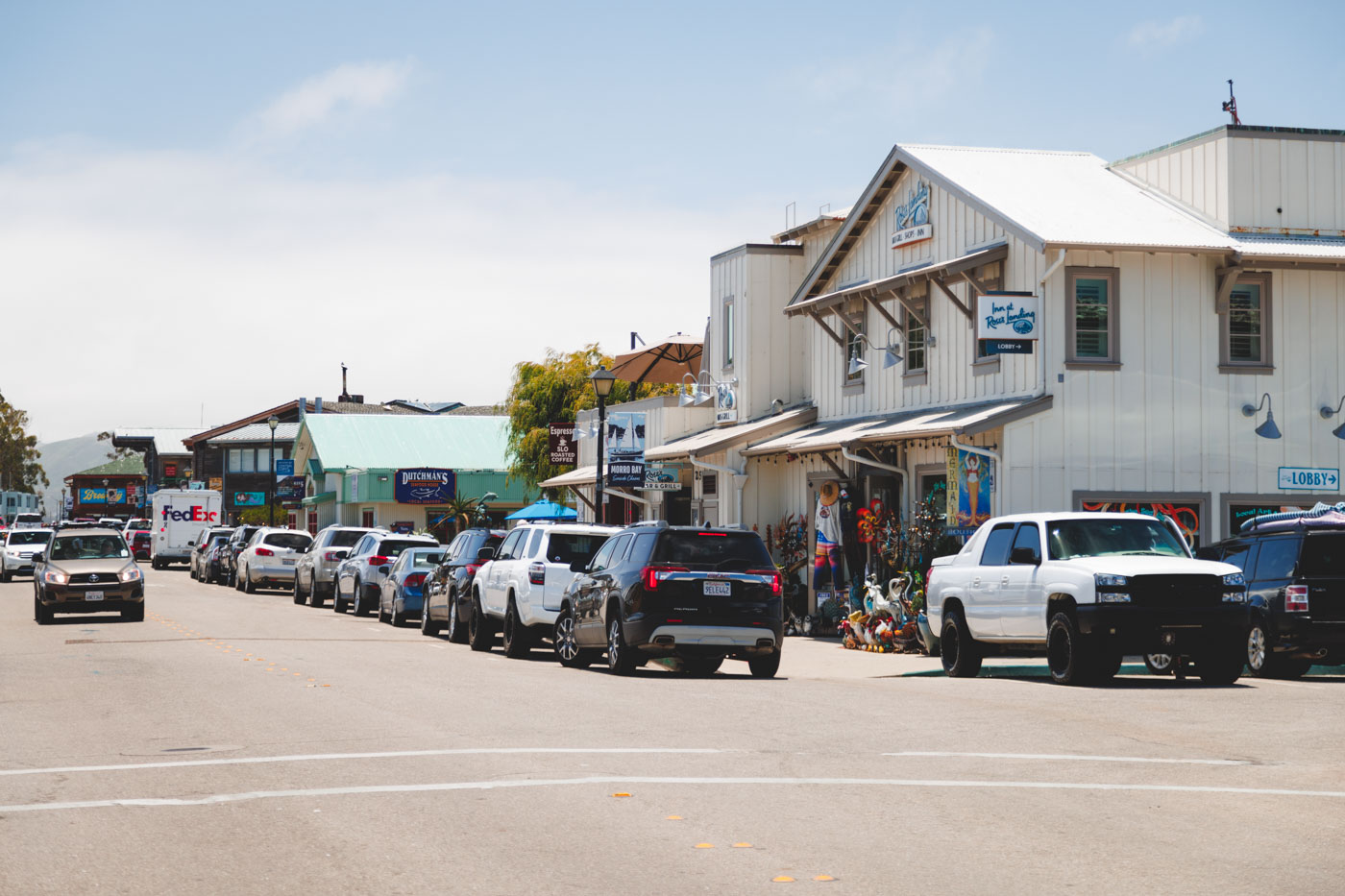 Cars parked along the main road through Morro Bay Town.