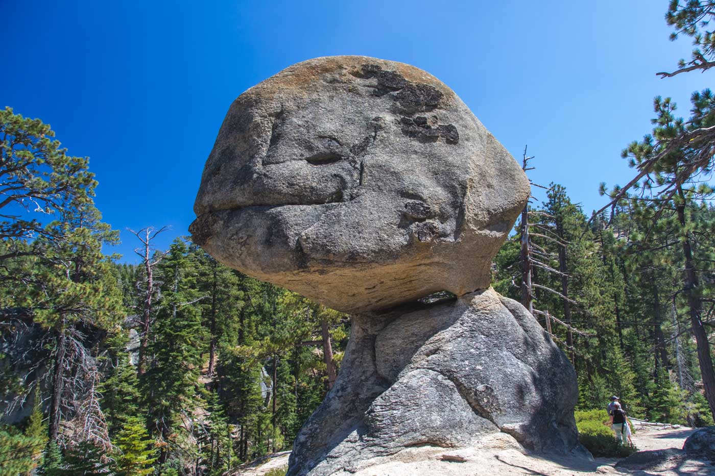 Balanced Rock in the middle of the forests of DL Bliss State Park on a sunny day.