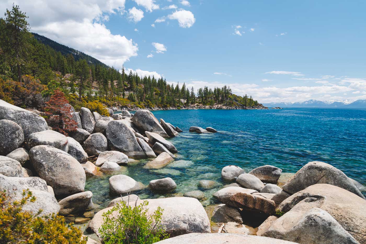 A view over the blue water around a rocky area of Lake Tahoe as seen from Memorial Point Scenic Lookout.