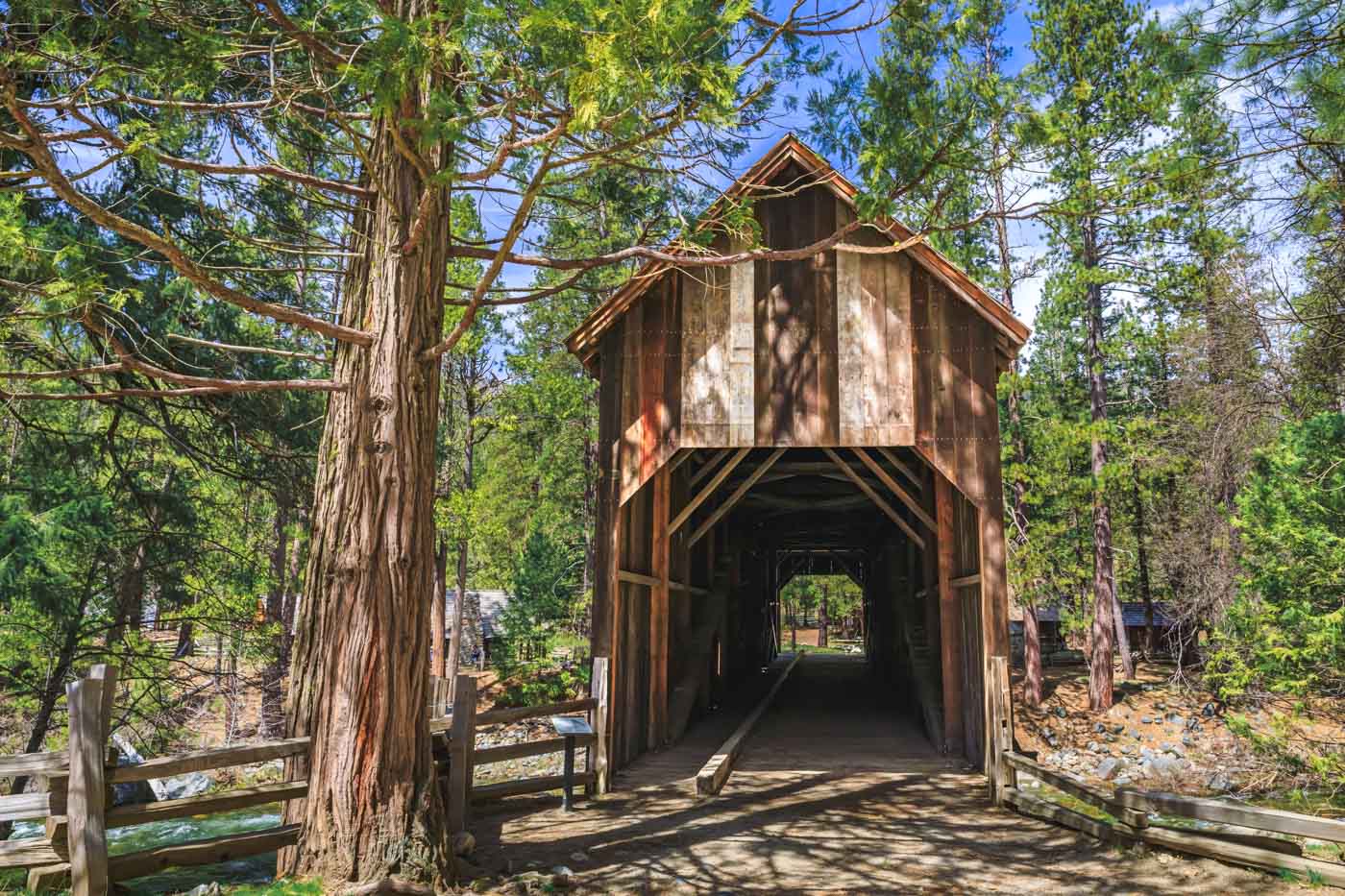 The old, wooden Wawona covered bridge in the middle of the Yosemite forest.
