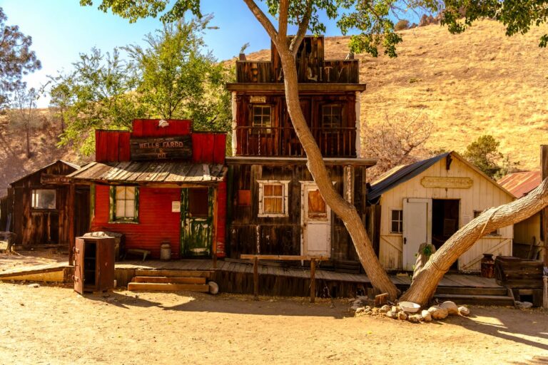 Vintage wooden structures in the sunny Silver City ghost town, California, USA.