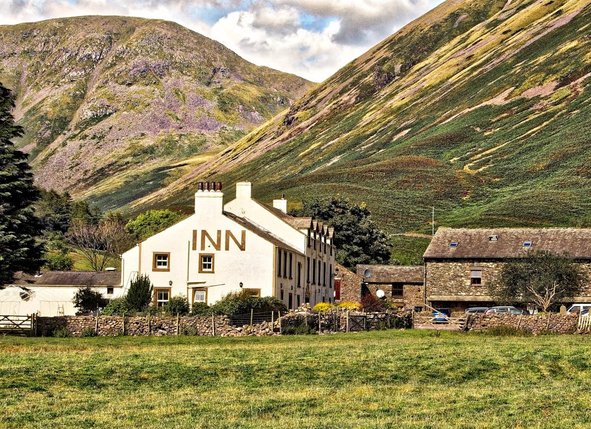 Charming countryside inn nestled against the scenic hills of Cumbria, England.