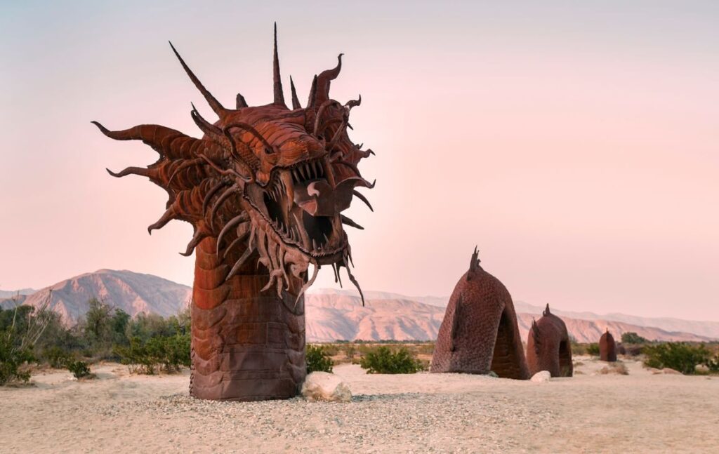 Impressive dragon sculpture in Galleta Meadows, capturing desert beauty at sunset.